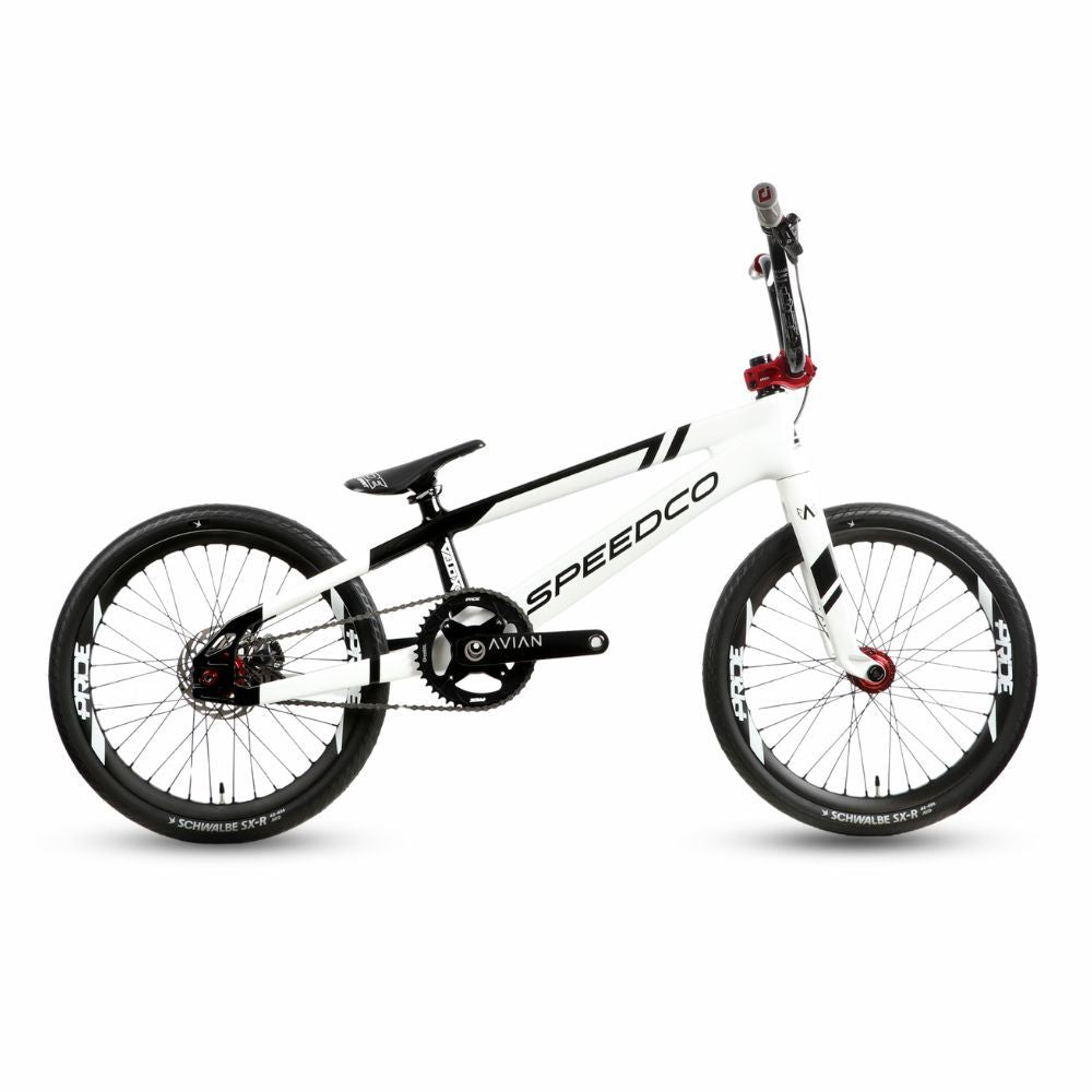 SpeedCo Velox Evo BMX race bike in neon yellow with carbon frame and performance components